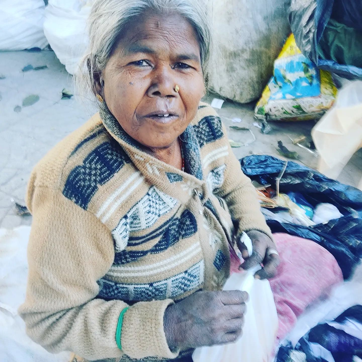 HCF volunteers handing food packages to a family during a distribution drive